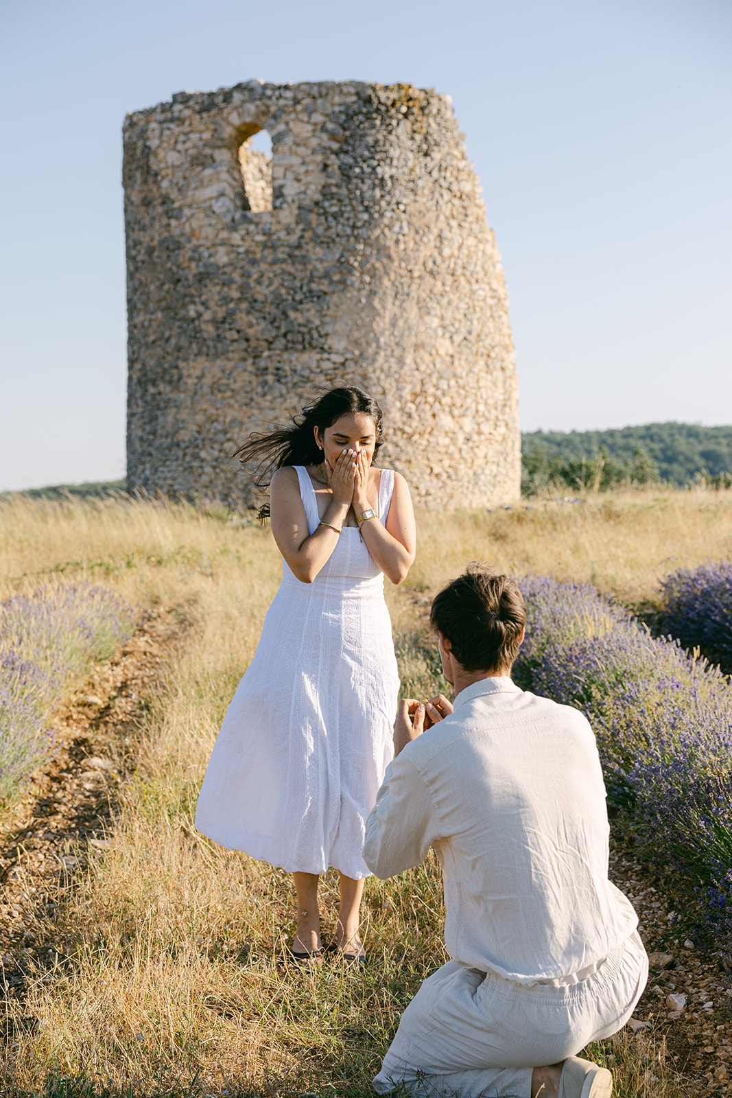 A couple during an engagement photo shoot in Provence in the late afternoon light